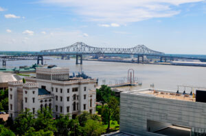 Picturesque scene of Mississippi River and Bridge in background behind the Old State Capitol.
