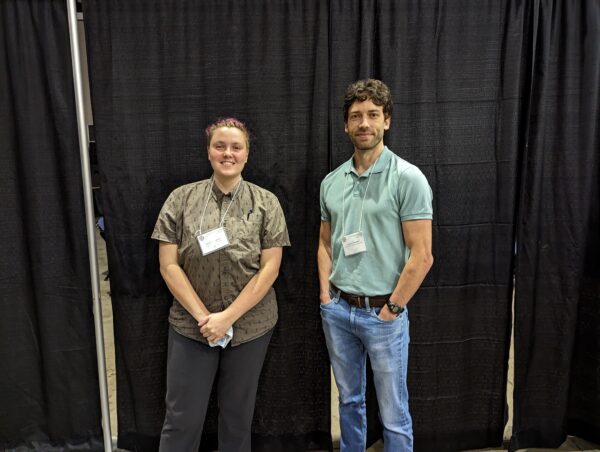 Student Paper winners Lia Kitteringham & Jordan Schaefer smile